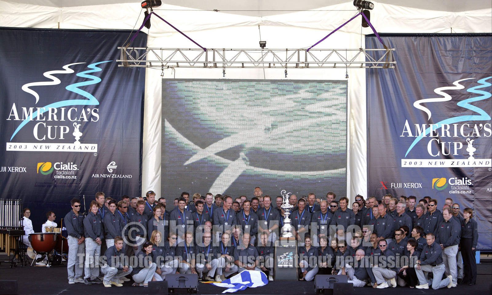 03_1486D ©Th.Martinez  - Auckland-New Zealand . America's Cup 2003. 3rd March 2003. .America's Cup prizegiving.All Alinghi Team, winner of America's Cup 2003, on stage..