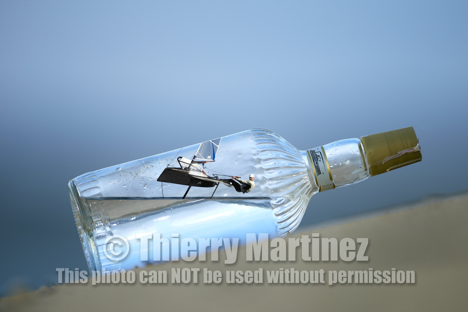 Photomontage.  Simon Payne (GBR) flying Moth in a bottle.